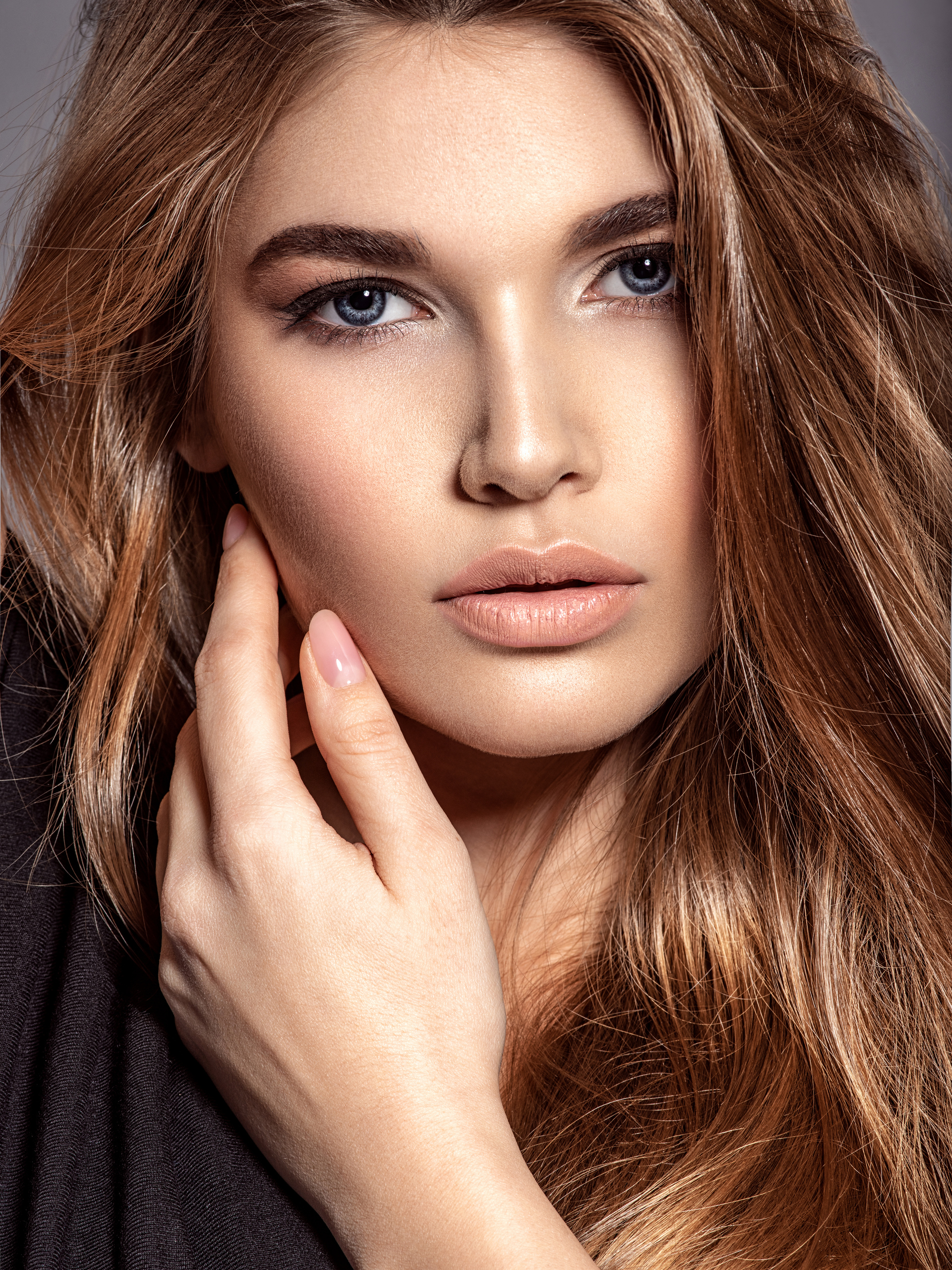 Close-up of a woman with long, flowing hair.
